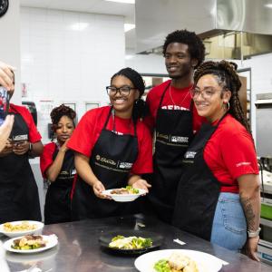 immersion program students in a kitchen together
