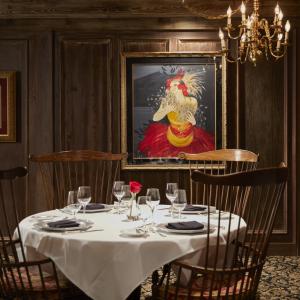 Restaurant table with paintings in the background
