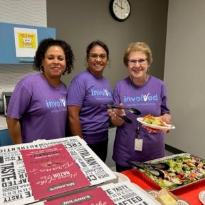 Three Short Hills volunteers serving food