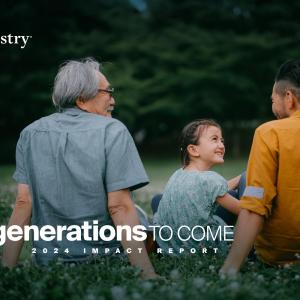 "For Generations to Come" with a family in the background