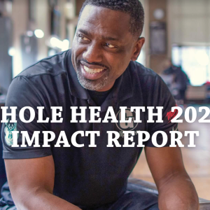 Person sitting and smiling. Reads: Whole Health 2021: Impact Report