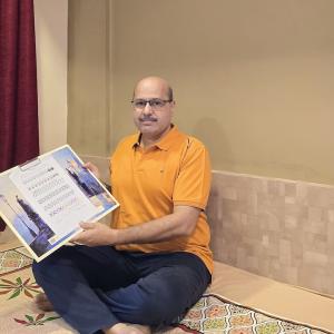 Abhay's Cool Tips for Career Success. Abhay shown with a book.