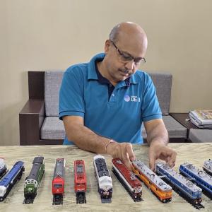 Abhay at work with his favorite hobby; model trains.