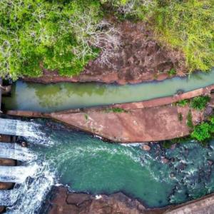 Aerial view of water running through a dam