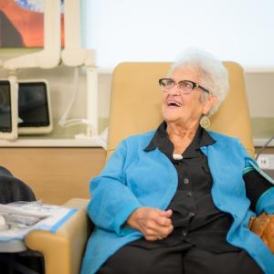 Elderly patient speaking to healthcare provider