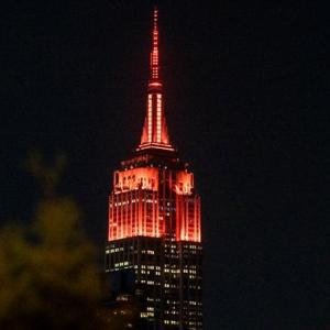 Empire State Building lit up in JBL orange.