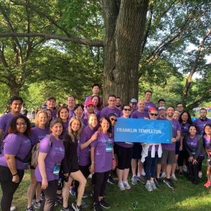 NYC volunteers standing outside under a tree
