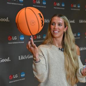 WNBA player Lexie Hull spins a basketball on her finger after participating in a discussion about maintaining good mental health held by LG Electronics North America and the National Alliance on Mental Illness (NAMI) on Friday, April 3, 2026, in Indianapolis, Indiana.