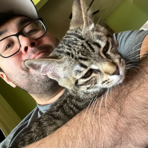 Jacob Rodriguez holding his cat.