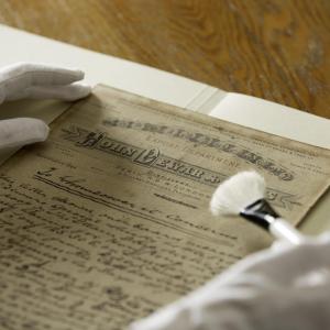 Jacqui preserves a handwritten note from Tommy Dewar, one of the DEWAR'S Scotch whisky founders, dated 1893