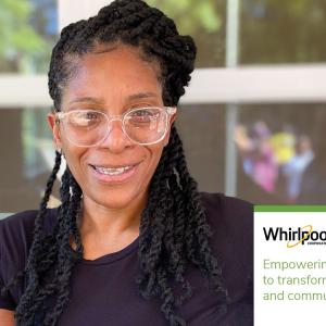 Janetta holding up house keys. "Whirlpool. Empowering women to transform their lives and communities."