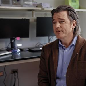 Image of Jason Case speaking in an office setting