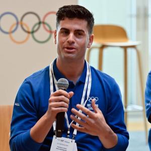 Javier Raya with a microphone, others to their sides.