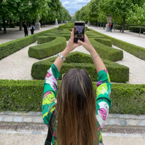 Jelena taking a selfie in a park.