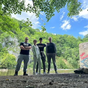 Jelena shown with friends at a river.