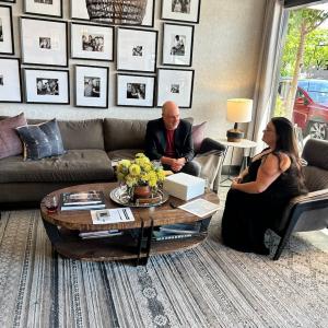 Jennifer Carson and Mark McCaffrey seated.