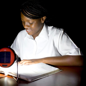 Person reading in the dark with small light