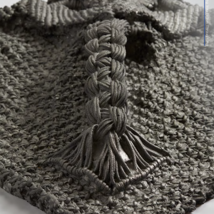 A grey woven art piece by Jesse Harrod