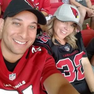 Jolie at a baseball game with her husband.