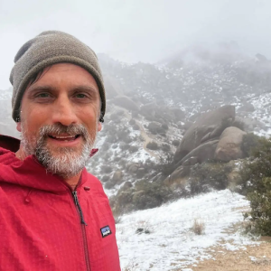 Jonathan doing a winter hike.