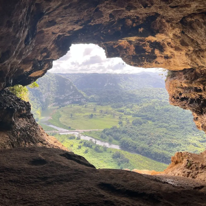 Entrance to a cave shown from the inside.