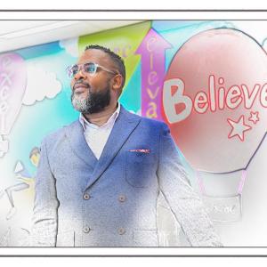 Julius B Anthony, "Believe" in the background. Image fades from black and white, like a coloring page, to full color around Julius