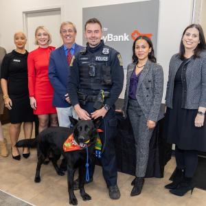 Police officer shown with K-9 Jet and representatives from KeyBank and The Hometown Foundation.