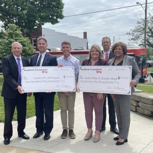 KeyBank Regional Sales Executive Tim Burke (second from right) along with KeyBank East Ohio Market President Eric Dellapina (far left) KeyBank Regional Retail Leader Becky Talley (far right) and Canton City Mayor Thomas Bernabei (far left) present Executive Director of Canton for All People Don Ackerman (third from left) with $200,000 grant and President and CEO of United Way Angela Perisic (third from right) with $250,000 grant.   