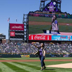 Genesis Rodriguez throwing the first pitch as part of the festivities
