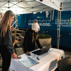An LA Kings fan registers to donate blood outside of Crypto.com Arena prior to the LA Kings home game.