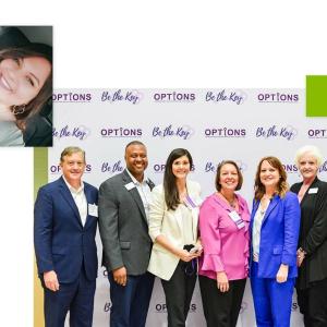 Kalie Stephens and others in front of a sign for OPTIONS