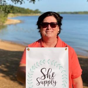 Kathy Meyer with She Supply sign