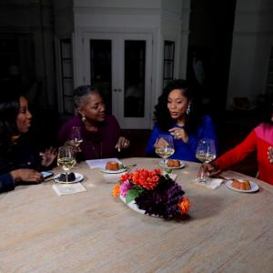 QVC Hosts Vanessa Herring, Jayne Brown, Monifa Days and Stacey Rusch are seated at a table while on-set at QVC Studios.