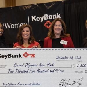 Key4Women presented with a check at Key4Women forum in albany.