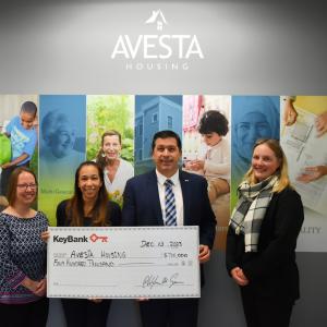 KeyBank Maine Market President Tony DiSotto, second from right, presents a check for $400,000 to (L-R): Avesta Housing Vice President of Property Management & Resident Services Amanda Gilliam, Avesta Housing President & CEO Rebecca Hatfield, and Avesta Housing Vice President of Advancement Sara Olson. (Photo courtesy Avesta Housing)