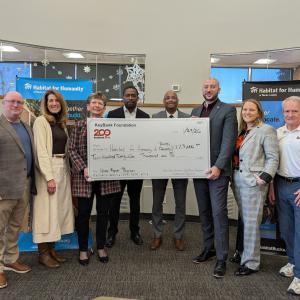KeyBank and Buck's County Habitat for Humanity representatives shown with the grant check for $225,000.