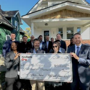 KeyBank and LISC Toledo representatives shown with a $400,000. grant check.