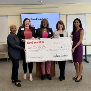KeyBank and YWCA leadership shown with the grant check.