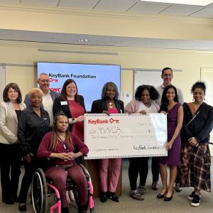 Team members from KeyBank and YWCA shown with the $240,000 grant check.