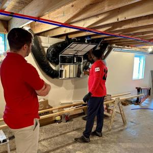 KeyBank representatives shown inspecting a newly built home.