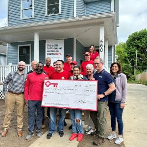 KeyBank and Rochester Habitat for Humanity team members shown with a $300,00 grant check.
