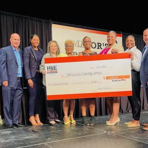 From left to right:  Brian Earley, Ivory Salmon, Teri Todd, Yvonne Harrington, Award Winner - Lakeshia Peterson, Nakesha Fulce, Rebecca Lomax & Nick Bontreger.