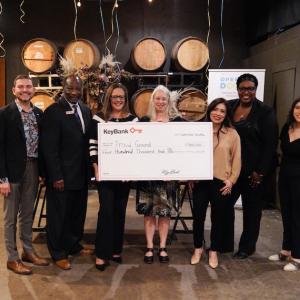KeyBank and Proud Ground Team shown with check for $400,000.