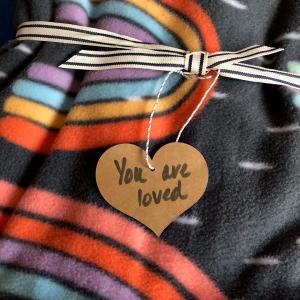 Words and Warmth blanket: Hear with "You are loved" shown.