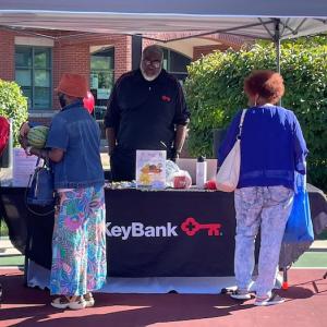 KeyBank volunteer table at the Farmers Market.