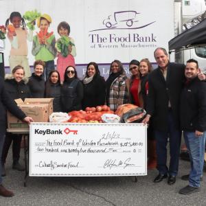 KeyBank and The Food Bank volunteers shown with check.