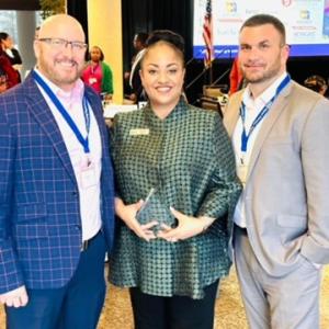 Keyna Taylor receiving the Marie Kindrick Award.