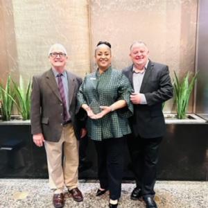 Kenya Taylor sown with the award.