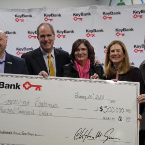 KeyBank and Conn Foodshare team with grant check.