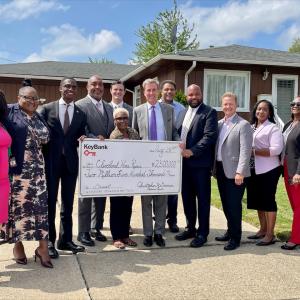 Representatives from Cleveland Home Repair accept a grant check from KeyBank for $2,500,000.